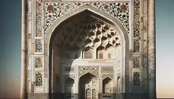 Taj Mahal's white marble facade with semi-precious stone inlay, showcasing Mughal arches and a chhatri against a clear blue sky.