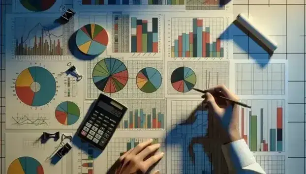 Gráficos de pastel y barras en colores variados sobre una mesa de trabajo con calculadora científica y manos sujetando un lápiz, analizando datos estadísticos.